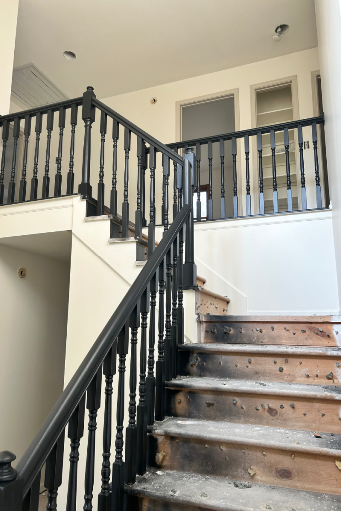 staircase with painted railing