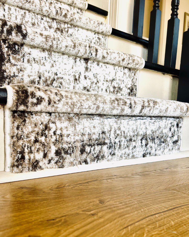 carpet runner on painted staircase