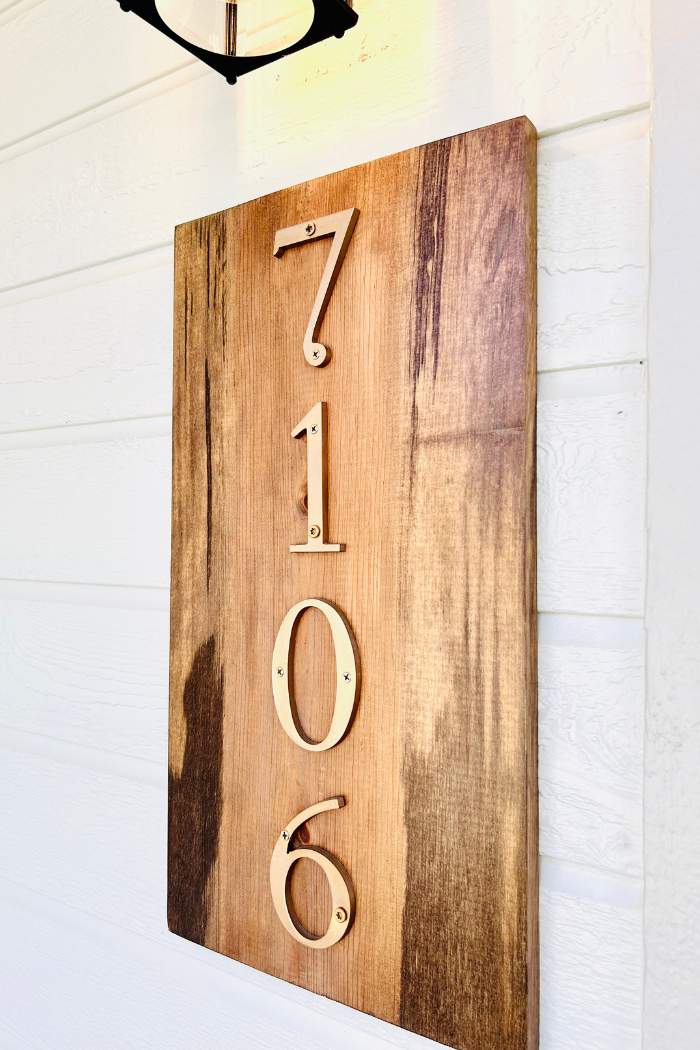 wooden house number sign