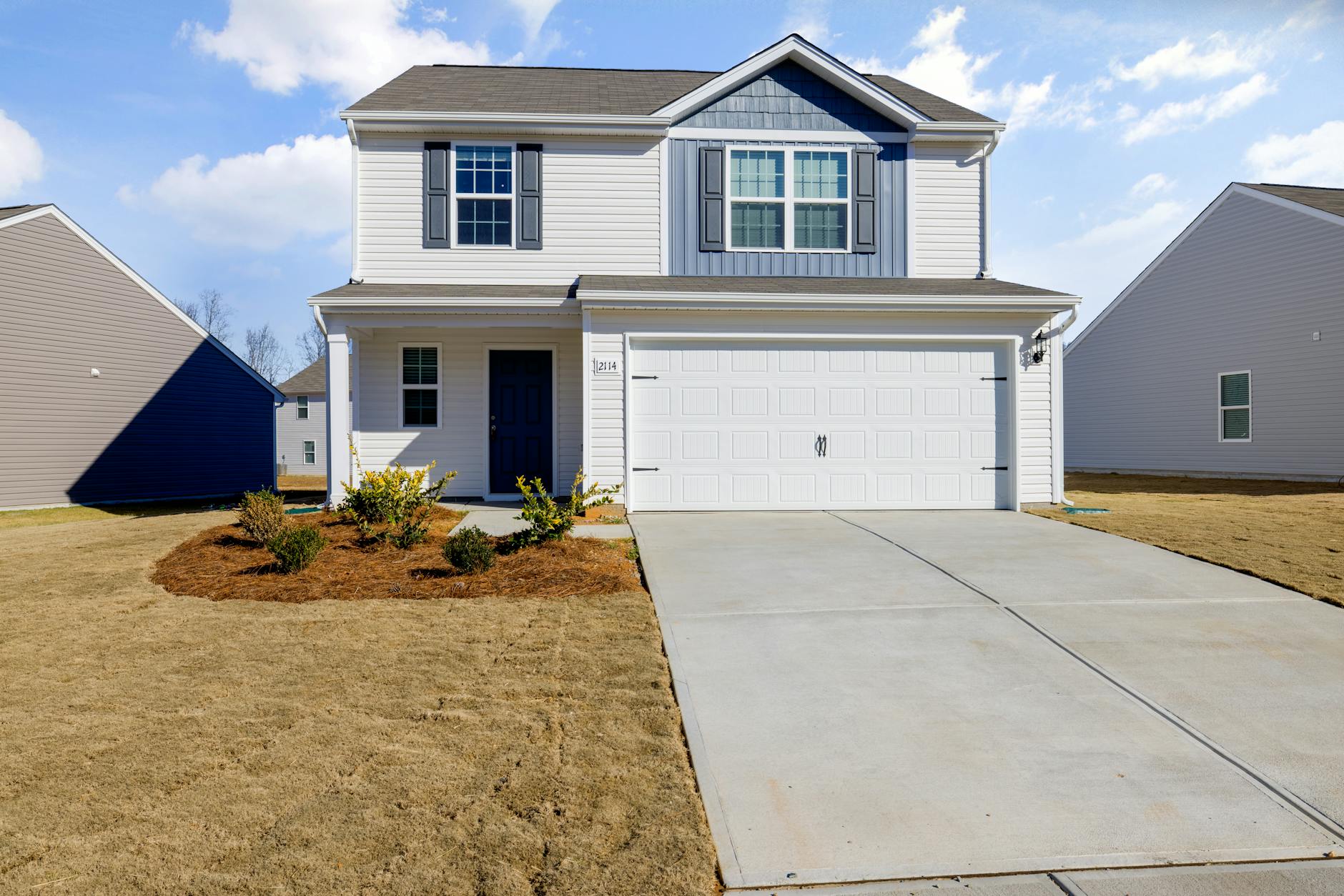 white and blue house under blue sky