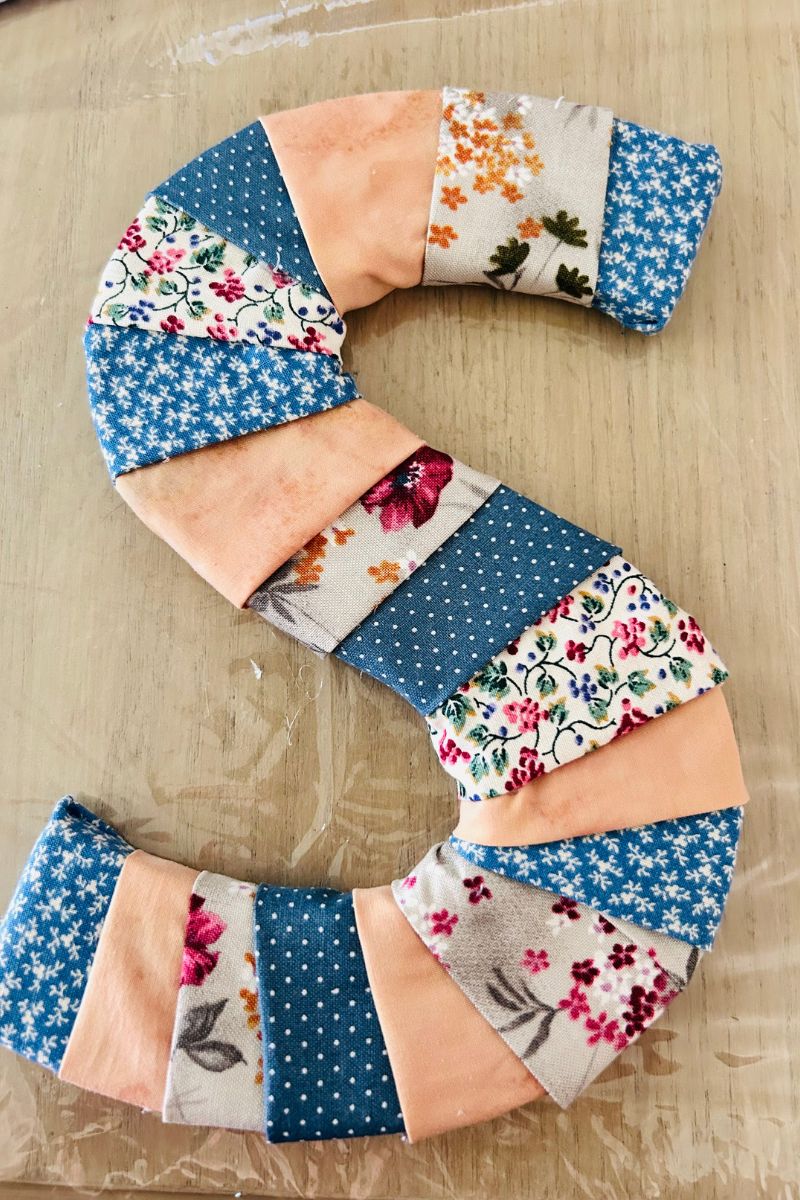 fabric strips glued to letter initial