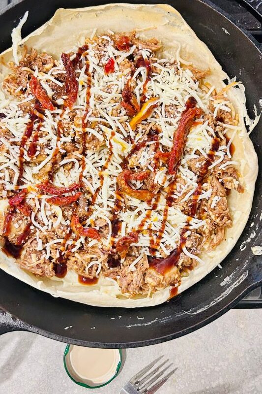 BBQ pulled pork pizza in skillet