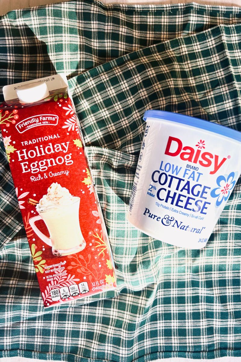 egg nog and cottage cheese on green plaid tablecloth